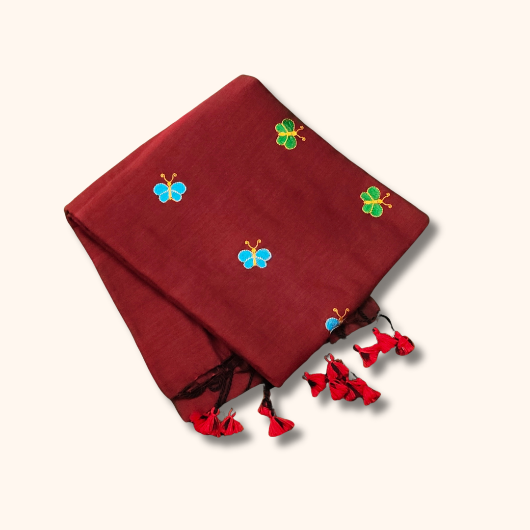 Mulmul Cotton Saree in Maroon with Butterfly Motifs & Tassel Pallu