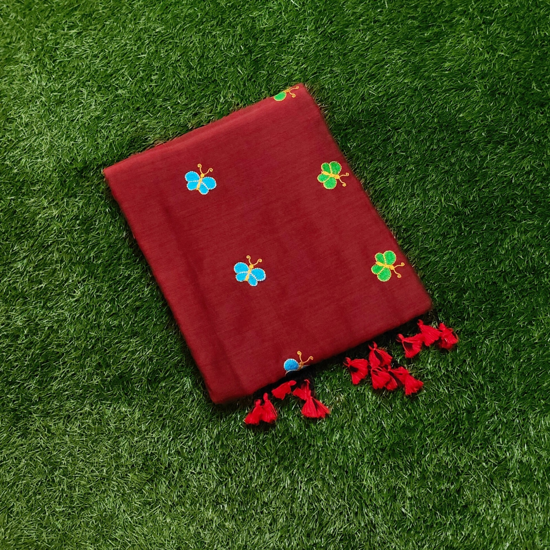 Mulmul Cotton Saree in Maroon with Butterfly Motifs & Tassel Pallu
