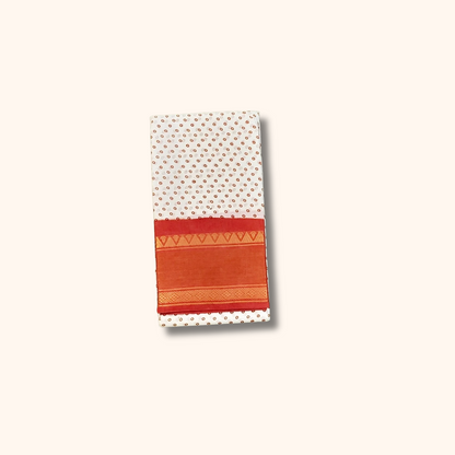 Off-White Cotton Saree with Tiny Floral Print & Orange Gold Zari Border – No Blouse