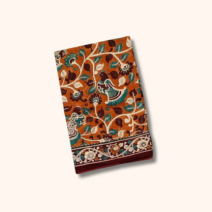 Rust Orange Kalamkari Cotton Saree with Peacock & Floral Motifs – Separate Blouse